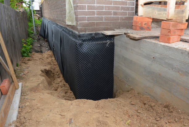 SJ Waterproofing Pros technician performing targeted Emergency Waterproofing assessment in Islip Terrace, NY